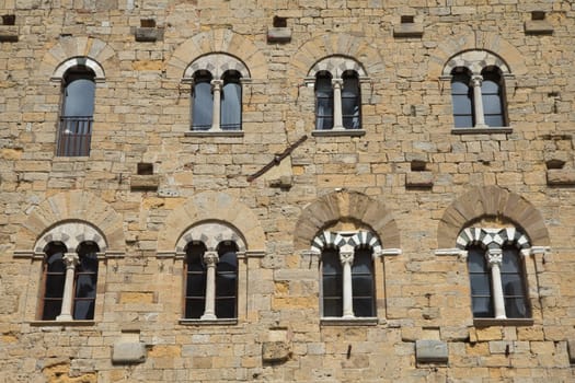 Detail of ancient architecture on the famous Piazza dei Priori (Volterra, Italy)