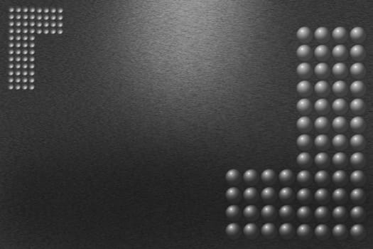 Pattern of brushed black metal background. Subdued light is in the upper middle part of the background. Three-dimensional spheres forming the letter L are in the corners of the image.