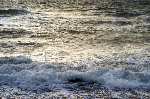 waves of foam spray in the ocean