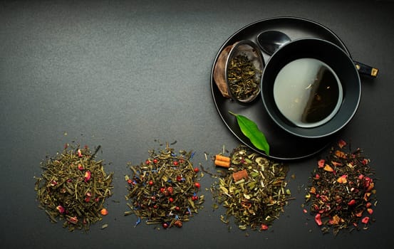 Cup of tea with dry tea collection of different types