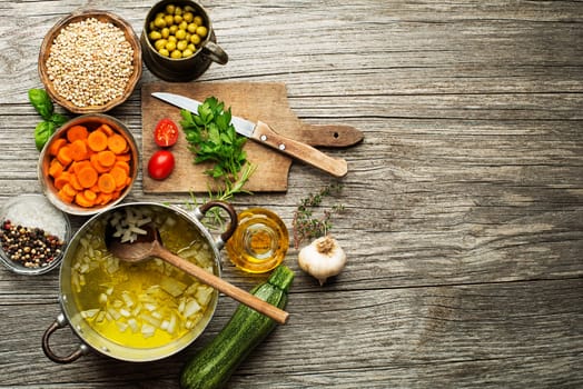 Ingredients for cooking fresh buckwheat porridge meal on wooden background