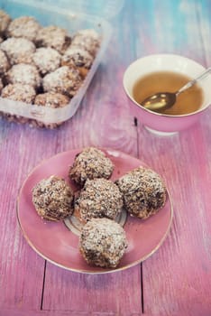 Cakes with tea on gradient color background
