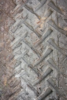 Tire tracks on a muddy road. It can be used as background