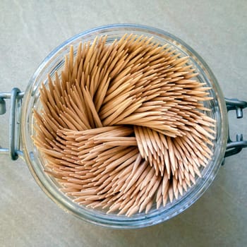 aerial view of a group of toothpicks in a glass jar