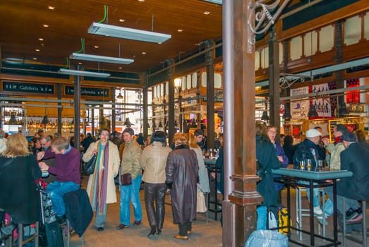 Madrid, Spain, february 26, 2010: People eat at Mercado San Miguel in Madrid.