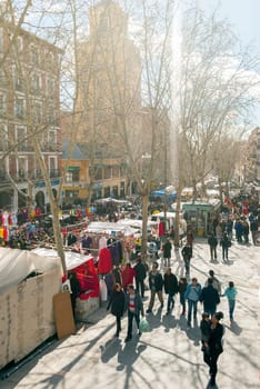 Madrid, Spain, february 28, 2010: Scene from El Rastro flea market in Madrid, Spain. El Rastro is held in La Latina neighborhood every Sunday and it’s the most important market in Madrid.