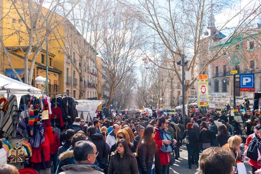 Madrid, Spain, february 28, 2010: Scene from El Rastro flea market in Madrid, Spain. El Rastro is held in La Latina neighborhood every Sunday and it’s the most important market in Madrid.