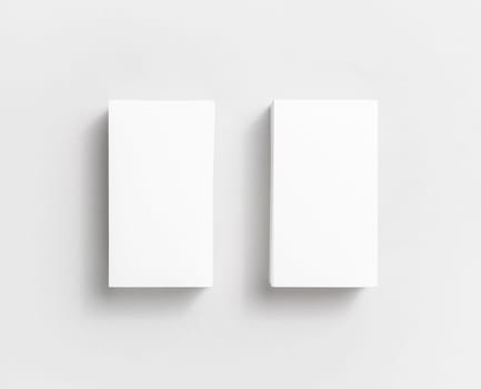 Photo of blank white paper business cards on paper background. Template for ID. Top view.