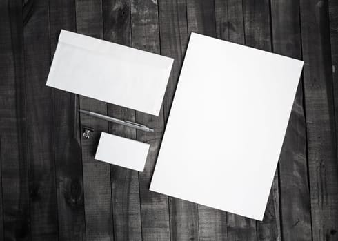 Photo of blank stationery set on wooden table background. Template for branding identity. Top view.