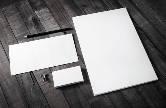Photo of blank stationery on wood background. Corporate identity set. Branding mockup. Responsive design template.