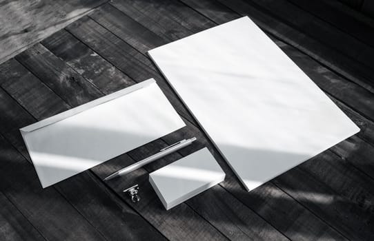 Brand identity template. Photo of blank corporate stationery set on wooden table background.