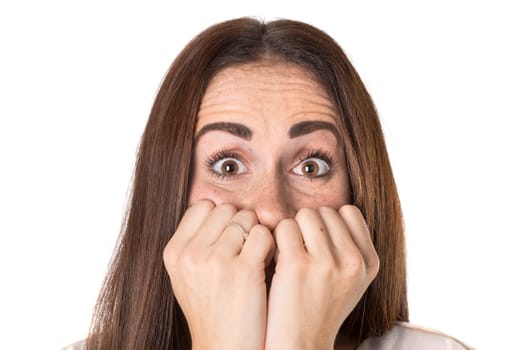 Stressed casual young woman isolated in a white background