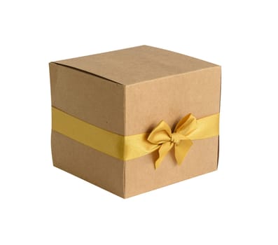 Brown gift box with gold bow isolated on white background