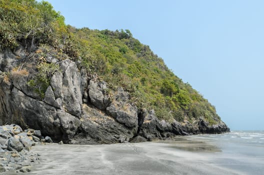 Tropical beach with rocky mountain