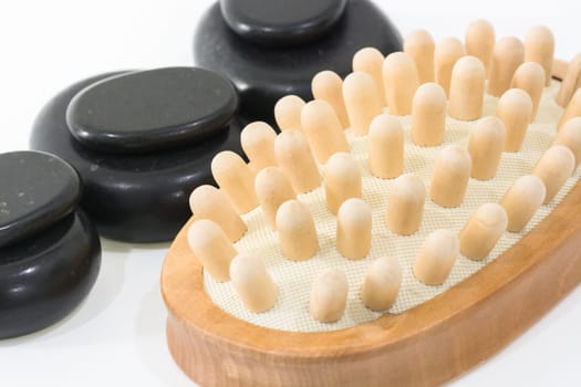Spa concept with hot stones and cellulite massager