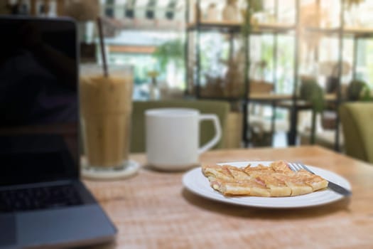 Easy meal in work hour with coffee drink and fried roti, stock photo