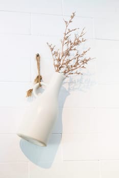 Dried little white flowers in vase, stock photo