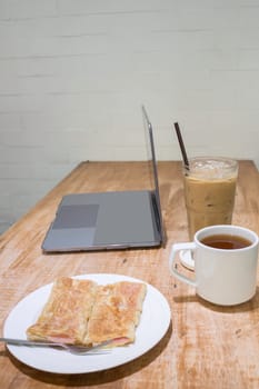 Easy meal in work hour with coffee drink and fried roti, stock photo