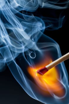 Match flame with blue smoke