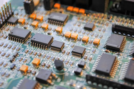 The computer electronic card with chips, microprocessors, transistors, explorers and other electronic parts.