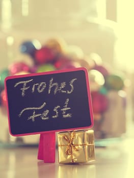 Christmas decoration on a table with space for text or image, selective focus on foreground