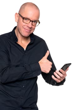 Studio recording of a man with a phone against a white background