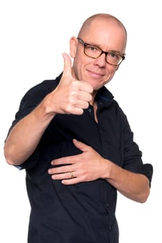 Studio recording of a man with outstretched thumbs against a white background