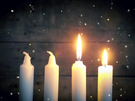 Advent candles on a rustic wooden background, Christmas concept