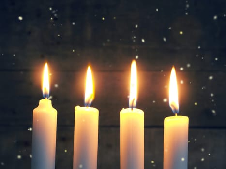 Advent candles on a rustic wooden background, Christmas concept