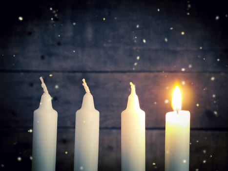 Advent candles on a rustic wooden background, Christmas concept