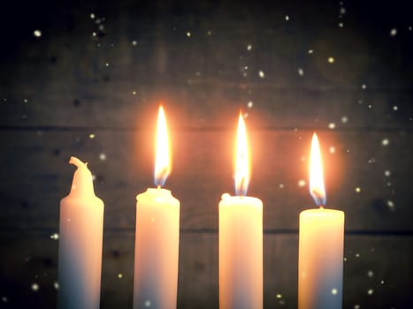 Advent candles on a rustic wooden background, Christmas concept