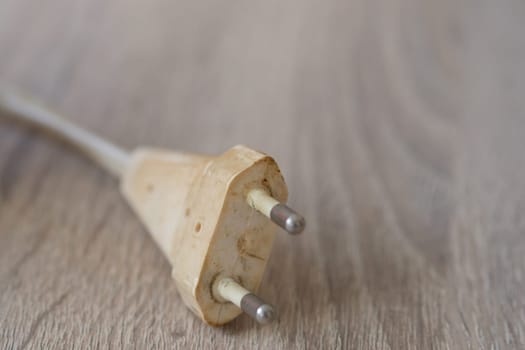 Dirty old dingy Euro plug with contacts as a close-up