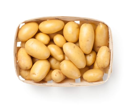 Raw potatoes in basket isolated on white background. Top view