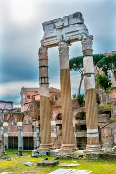 Temple of Vespasian and Titus Corinthian Columns Roman Forum Rome Italy.  Temple created in 79 AD by Emperor Titus, finished by Emperor Vespacian