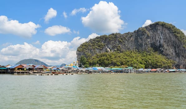 Landscape of limestone karsts of Phang Nga Bay National Park. Panyi island or Koh Panyee, floating fishing village in Phang Nga Province, Thailand