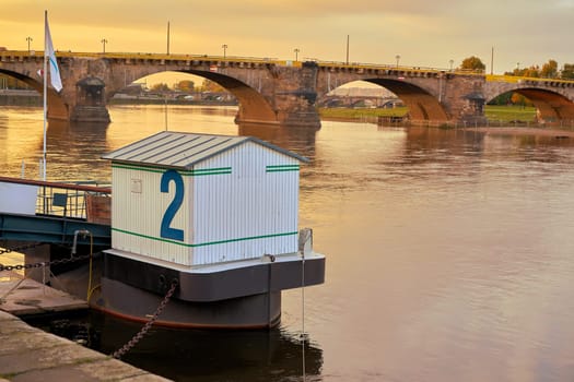Landing stage for excursion steamers on the banks of the Elbe in Dresden at sunset