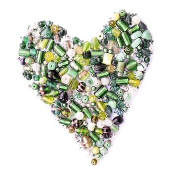 collection of green glass beads in the shape of a heart