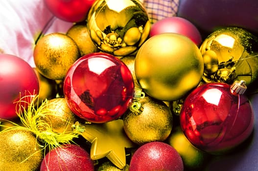 Selection of red and yellow Christmas balls and stars for tree decoration