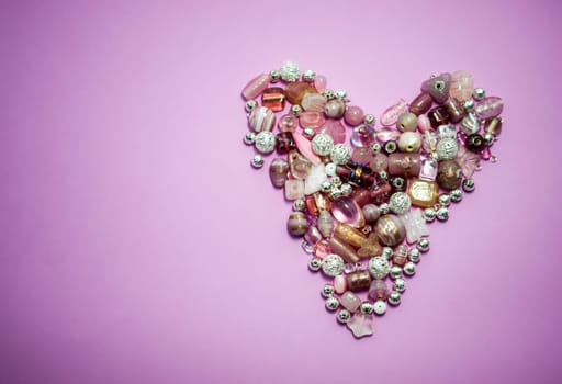 collection of Pink glass beads shaped into a heart