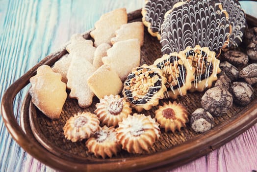 Tasty different cakes set on a color gradient background