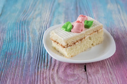 Tasty mini cake on a color gradient background