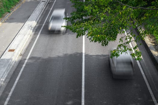 Motion blur of cars in aerial view over the road. (Speed limits - Infractions - Speed Cameras)