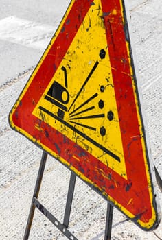Signage - unstable material on the road.