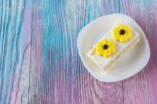 Tasty mini cake on a color gradient background