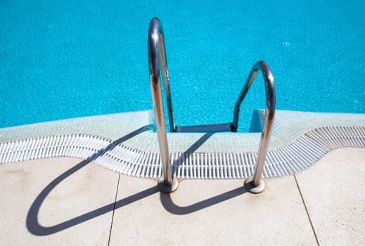 Pool ladder step of a swimming pool, Andalusia, Spain