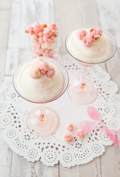 Cream dessert with popcorn in a martini glass