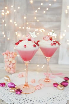 Cream dessert with popcorn and pomegranate in martini glass