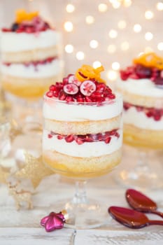 Dessert in layers with white chocolate mousse,orange and pomegranate