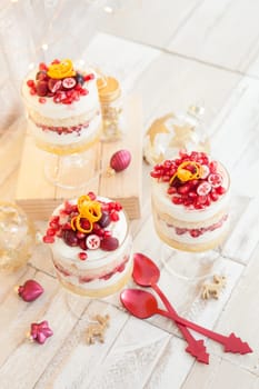 Dessert in layers with white chocolate mousse,orange and pomegranate