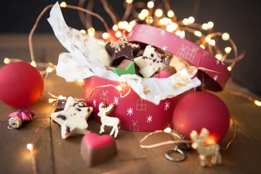 Small box with colorful chocolates for Christmas